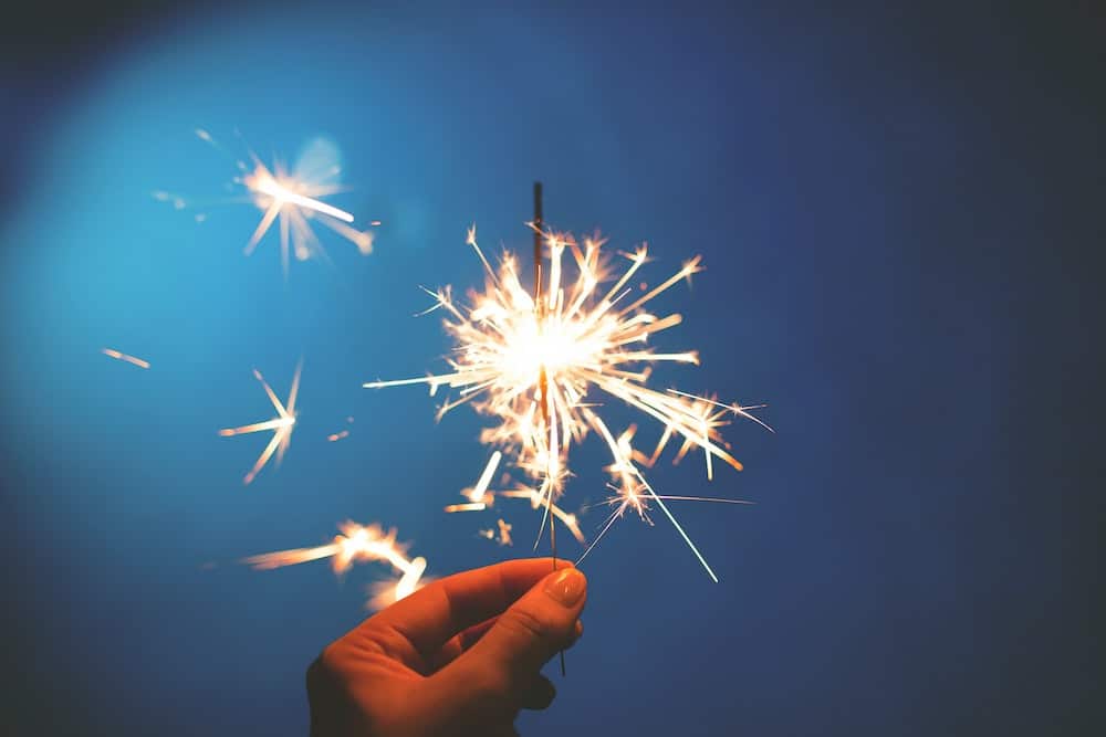 summer fire safety - person holding sparkler